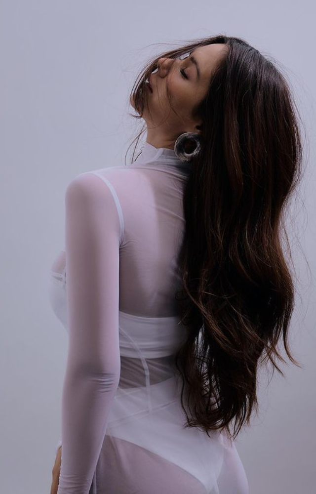 Sonam Bajwa sparkles in a white net dress, radiating a brilliant presence that effortlessly steals the show and a radiant charm and enchantment.