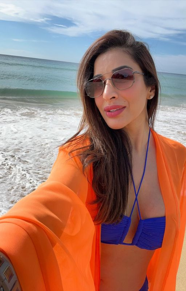 Sophie Choudry embodies summertime splendour with her flawless combination of beachside charm and grace, looking stunning in a blue bikini.