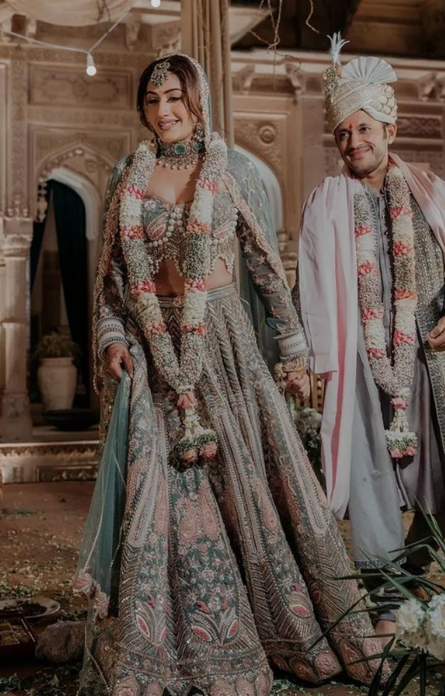 Witness the beauty of tradition as Surbhi and Karan take solemn steps around the sacred fire, embracing the essence of an Indian wedding.