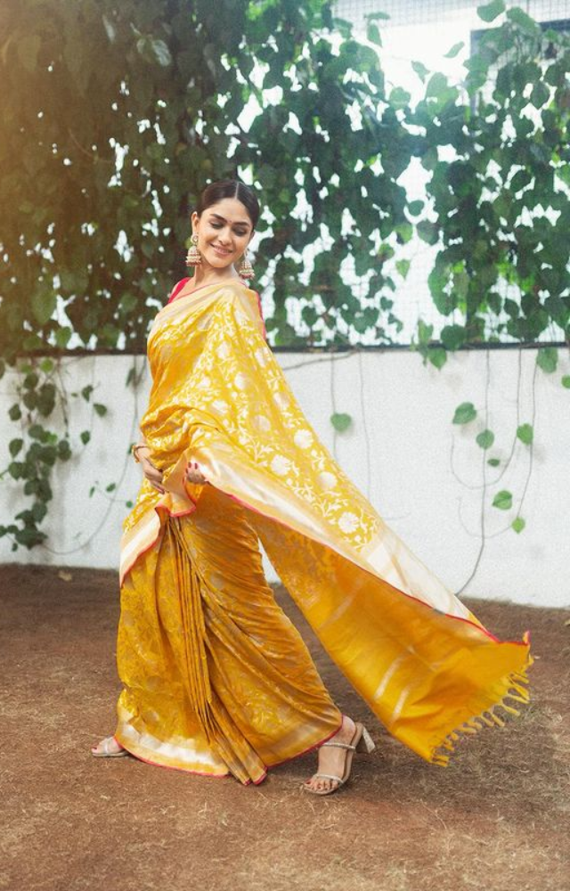 Mrunal Thakur dons stunning Indian attire, embodying cultural allure with grace and sophistication in traditional garments.