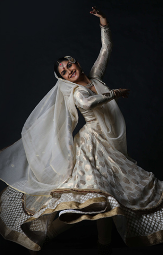 Originating in northern India, Kathak dance blends elegant motions, storytelling, and rhythmic footwork. It blends influences from Islam and Hinduism
