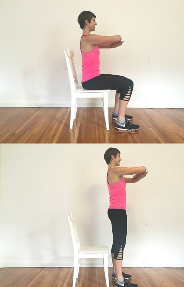Stand in front of your chair, lower yourself like you`re about to sit, then rise. Repeat to activate your glutes and legs without leaving your desk.
