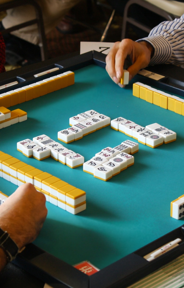 A centuries-old Chinese tile game that challenges memory, skill, and strategy.
