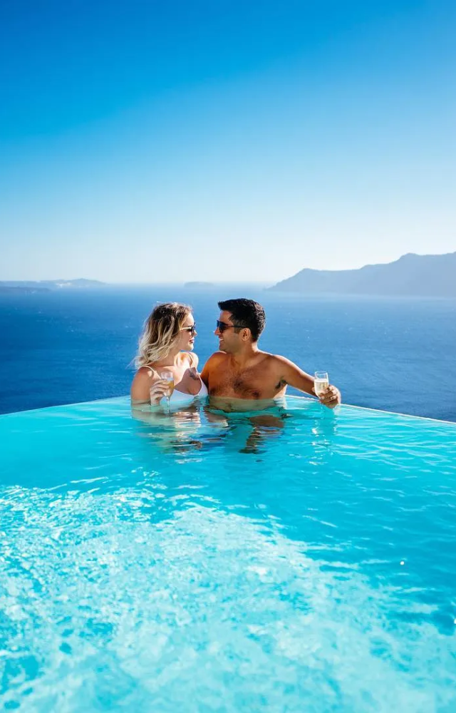 Enjoy the tranquil shores of Santorini, perfect for a relaxing beach vacation.