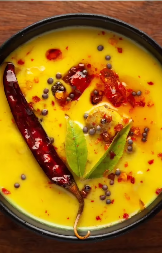 A tangy yogurt-based curry thickened with besan. Comfort food with a zesty twist.