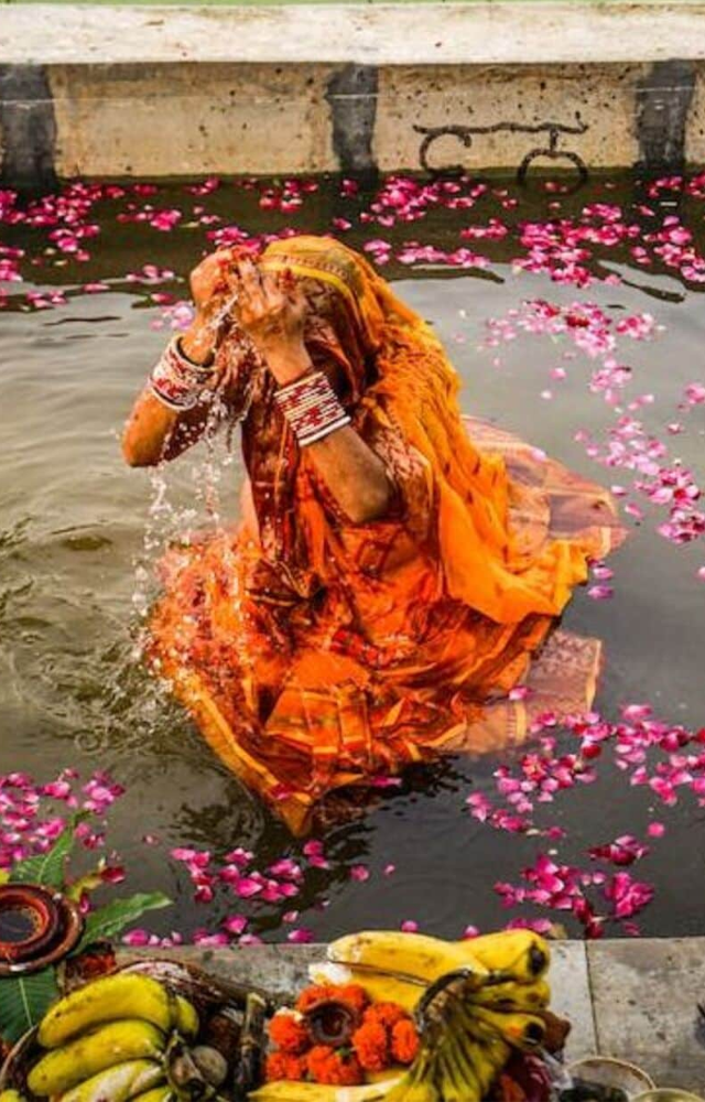 The rituals of Chhath Puja include preparing offerings and standing in water, expressing hopes for health and prosperity.