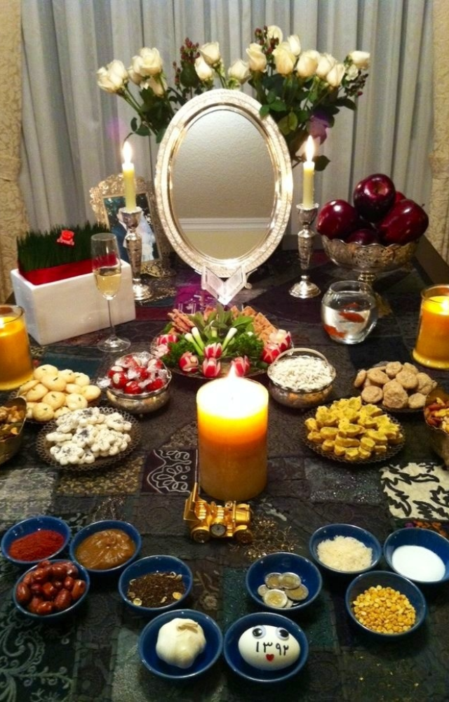 A central tradition of Nowruz is the Haft-Seen table, adorned with seven symbolic items starting with ‘S.’ Each represents growth, health, and prosperity.