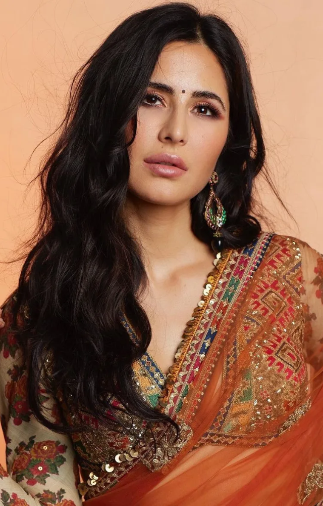 Katrina Kaif enjoys her sleek Range Rover Vogue Wheel Base, a symbol of elegance and class.