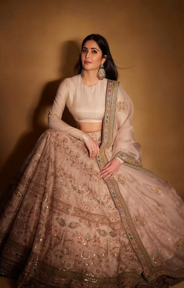 Katrina’s pastel lehengas and elegant salwar suits are perfect for a graceful festive vibe.