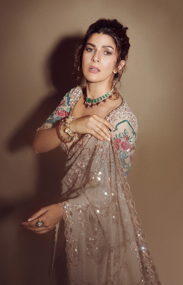 Her floral pastel saree is a dreamy choice, blending soft hues with effortless grace for a timeless ethnic look.
