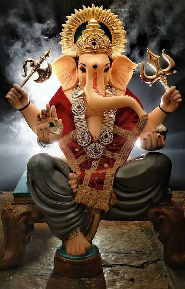 The elephant-faced form embodies wisdom, power, and simplicity, guiding devotees towards enlightenment.
