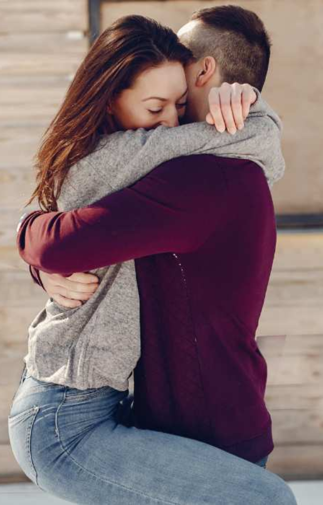 A tight, comforting hug that symbolizes deep love and security. It shows a strong emotional connection.