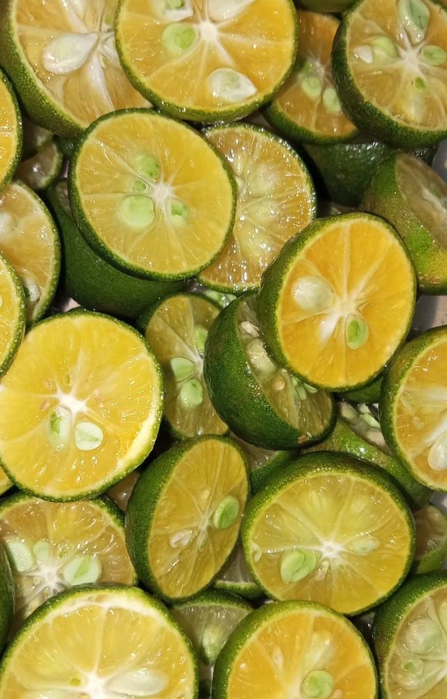 A cross between a lime and a mandarin, calamansi is small but explosively sour and common in Filipino dishes and juices.
