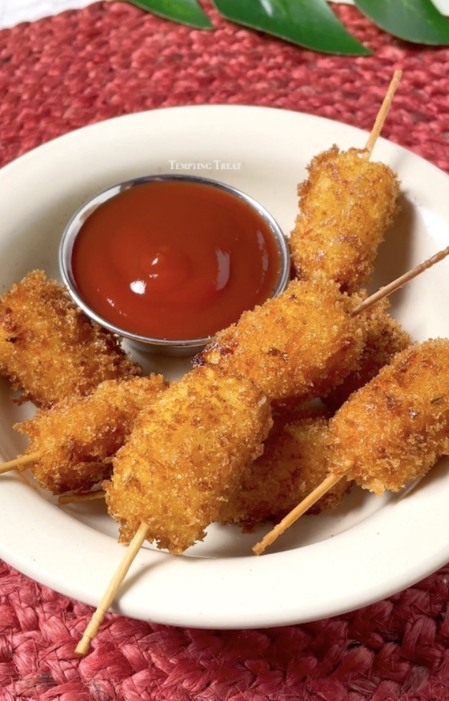 Crispy fritters with gooey melted cheese inside—a perfect combination of crunch and flavor. A cheesy twist to your tea-time snack!
