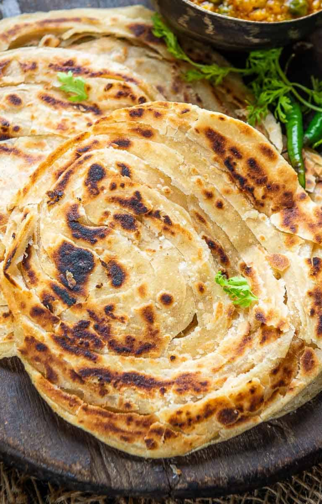 Layered and crispy, this buttery flatbread is perfect for mopping up creamy and spicy curries.
