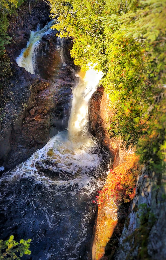 A mysterious waterfall where water disappears into a hole without a trace, baffling scientists.