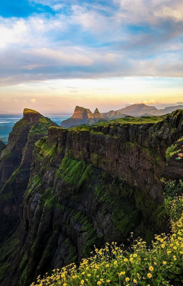 With dramatic cliffs and the iconic Konkan Kada, this trek is a monsoon dream.