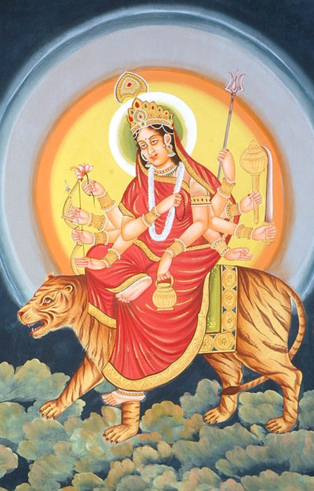 She has a third eye that signifies divine vision and cosmic awareness.
