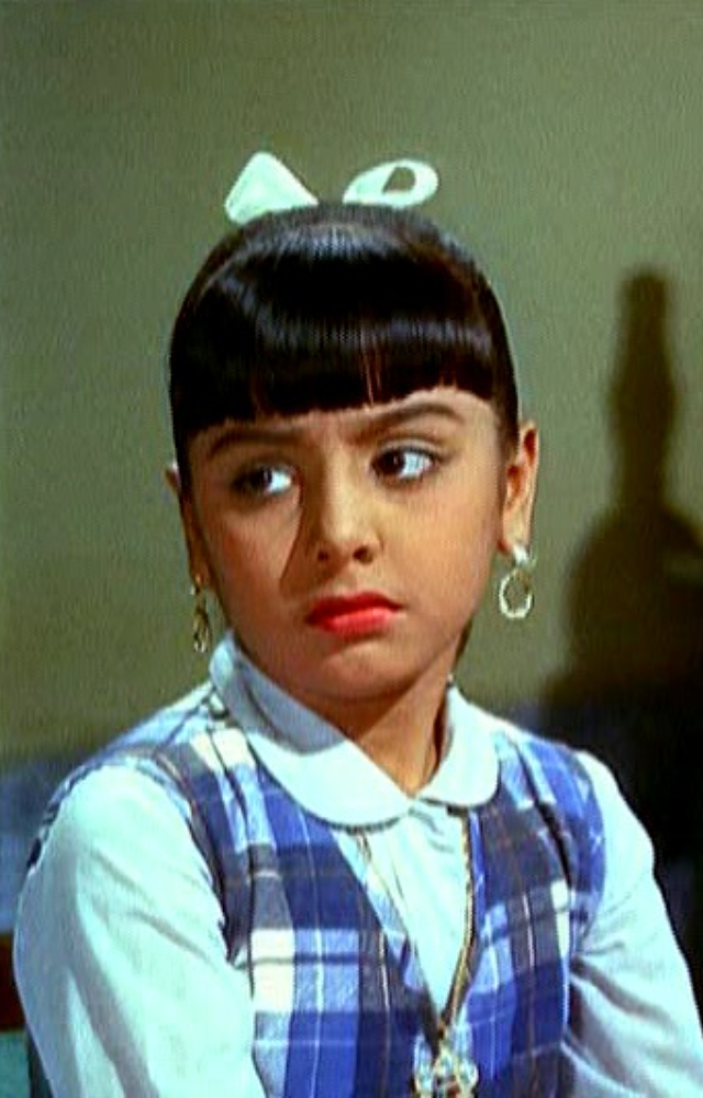 Neetu played dual roles as a child artist in this emotional family drama. A beautiful start to her cinematic journey.
