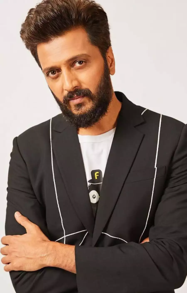Known for his impeccable comic timing, Riteish has entertained audiences in films like Masti, Housefull, and Dhamaal.