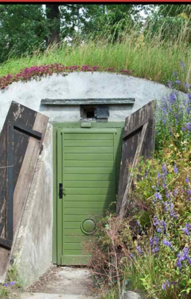 Locate the nearest bomb shelter or a well-constructed building that can provide protection in case of a nuclear event.
