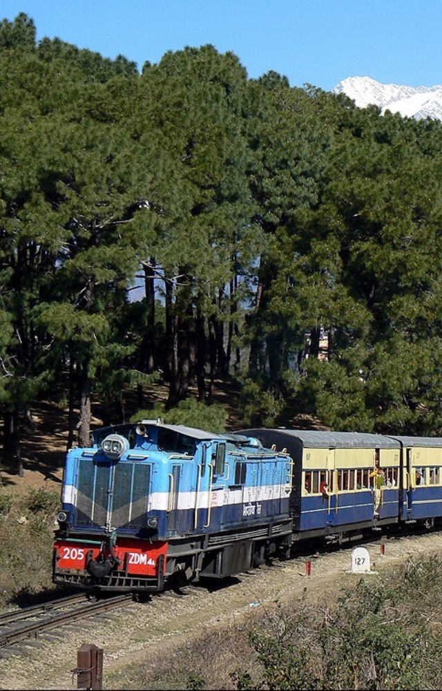 This narrow-gauge journey through Himachal offers rustic bridges, river crossings, and serene Himalayan backdrops.