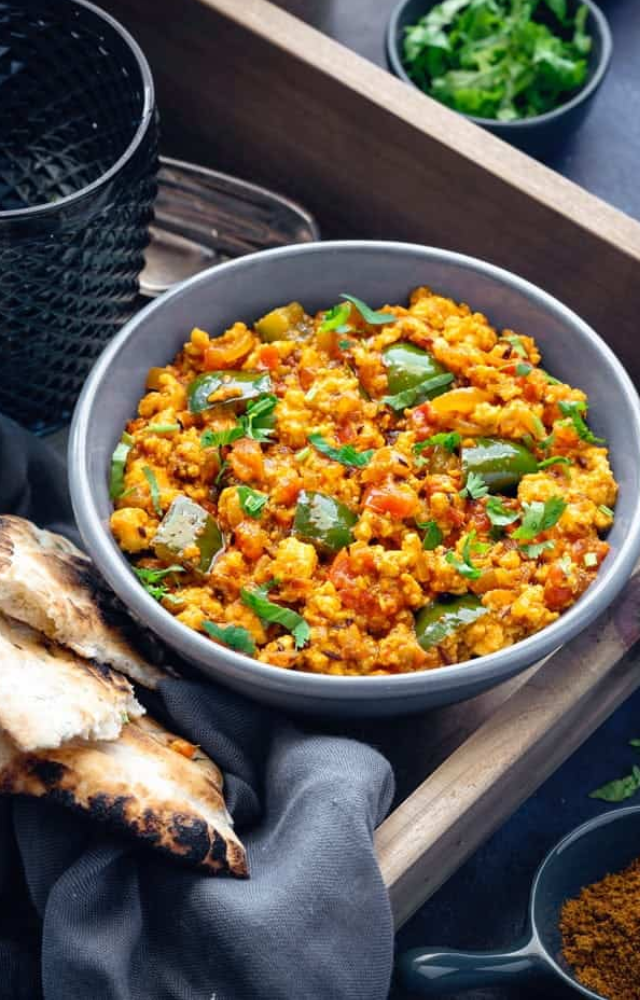 Crumbled paneer cooked with capsicum, tomato, and onions makes a filling, high-protein wrap perfect for lunch or dinner.