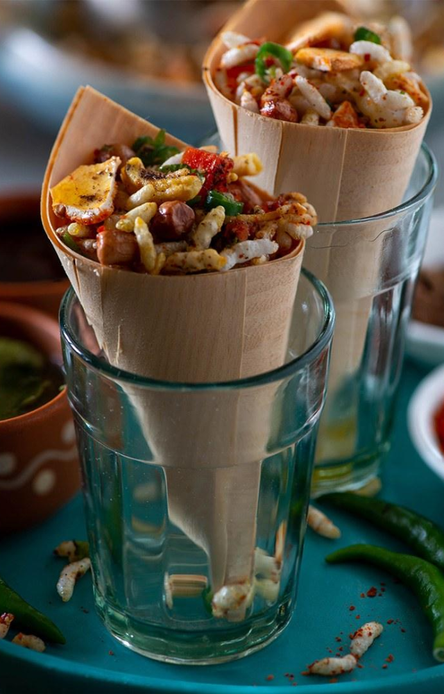 This puffed rice snack, loaded with spices, peanuts, and mustard oil, is a flavorful delight at Kharagpur station.