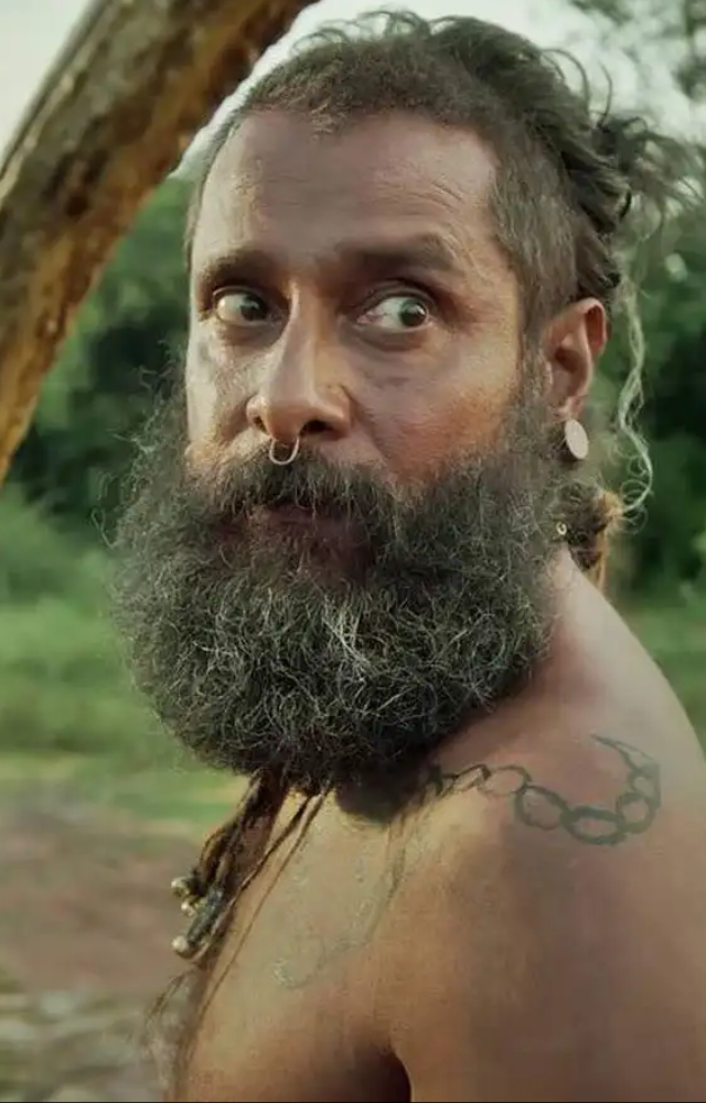 Set in a pre-independence era, Vikram transforms yet again. This gritty role shows his raw and rugged avatar like never before.
