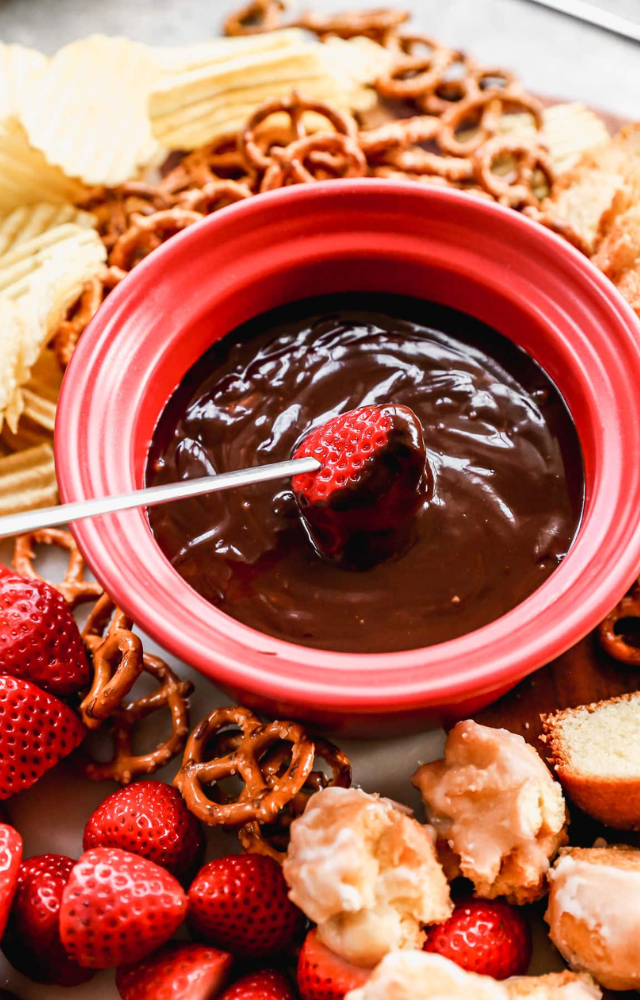 Dip strawberries, marshmallows, and more into rich, melted chocolate for a romantic treat.