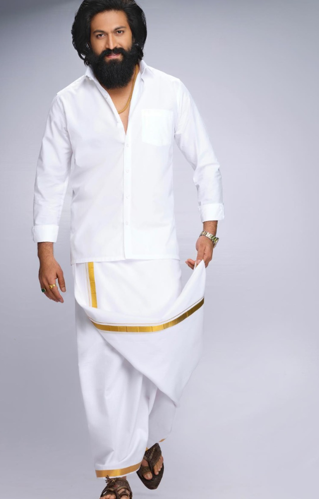 Frequently seen in traditional kurta and pajama or dhoti, showcasing his Kannada heritage.