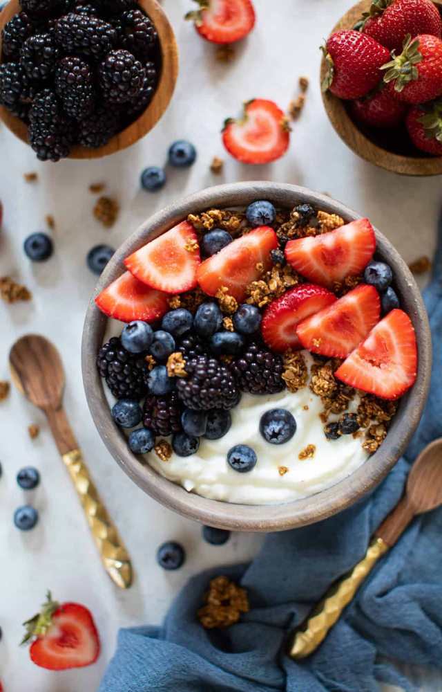 A low-fat Greek yogurt mixed with granola, berries or seasonal fruits, and nuts aids in restoring the glycogen and carbohydrates you used up during the workout.